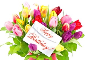 happy birthday! colorful bouquet of fresh tulips with card